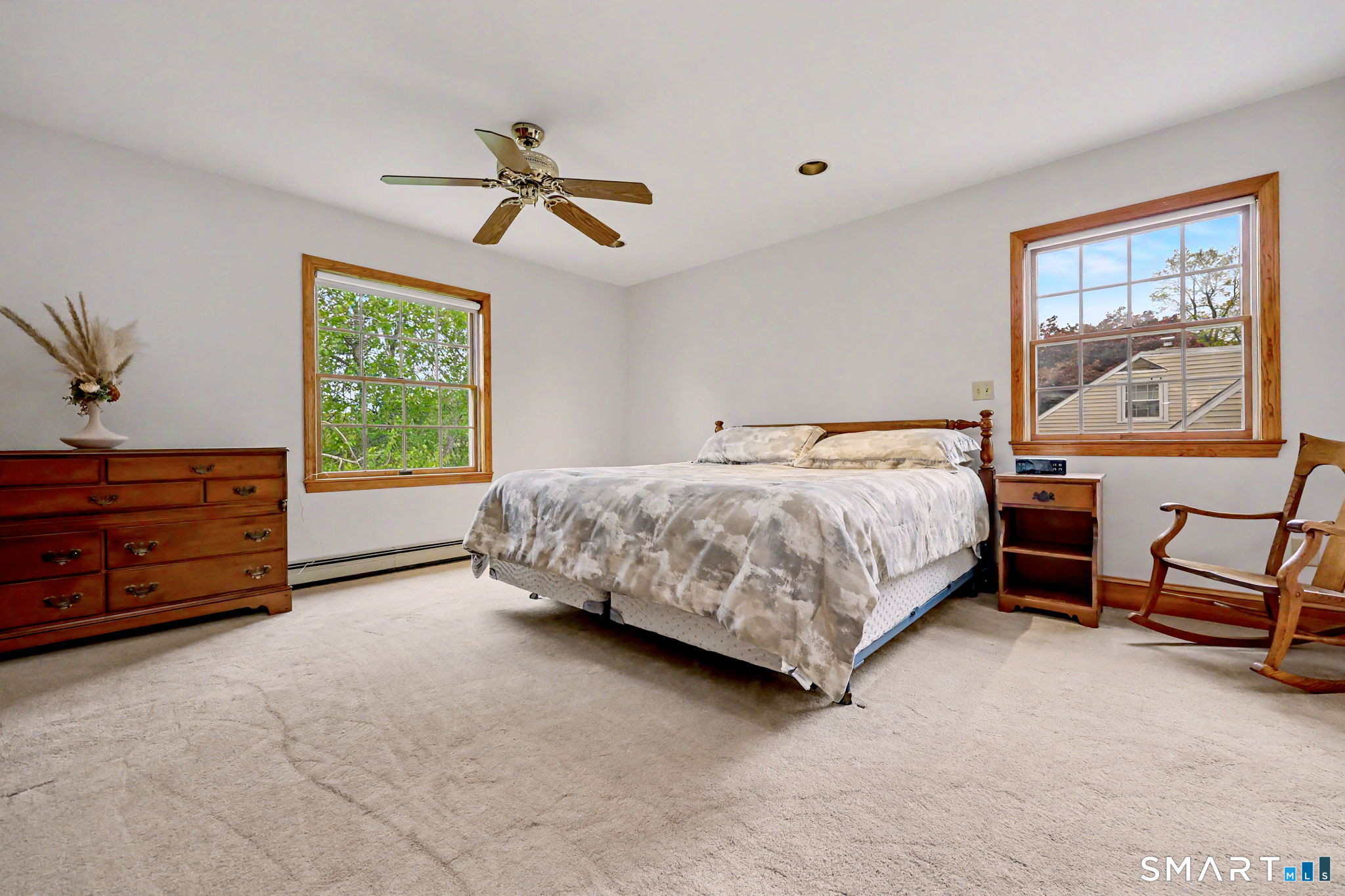 7 Merrill Road Trumbull, CT 06611 - Photo 21 of 40 a bedroom with a bed and a painting on the wall