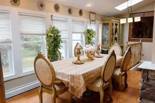 a dining room with furniture and window