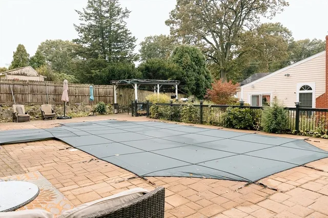 a backyard of a house with yard and seating space