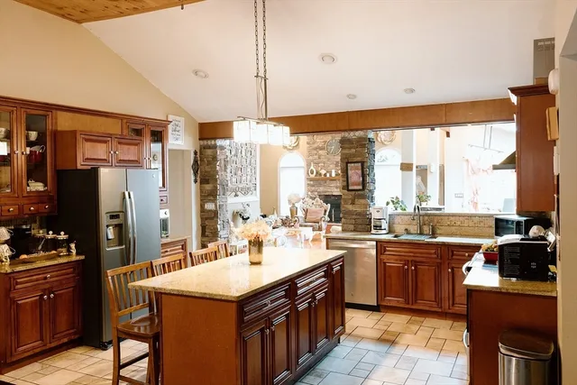 a kitchen with a sink stove and refrigerator