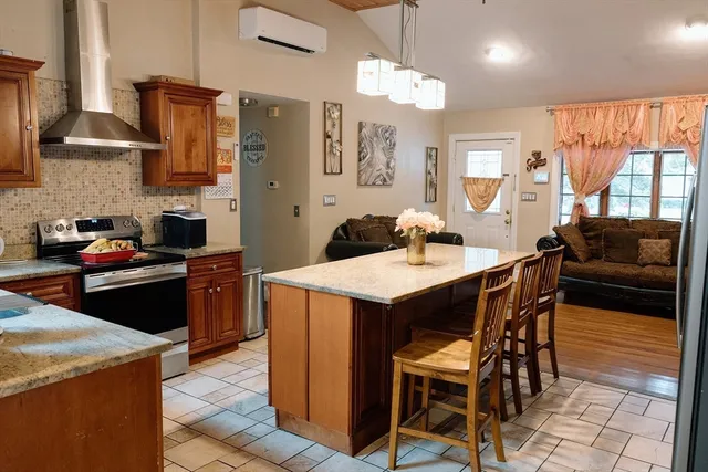 a kitchen with a dining table and chairs