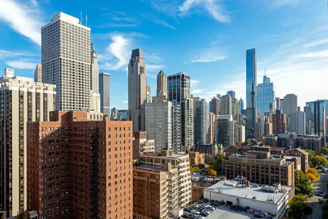 a view of city with a tall building