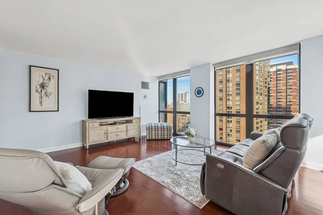 a living room with furniture and a flat screen tv