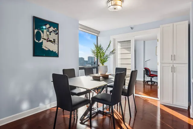 a view of a dining room with furniture window and wooden floor