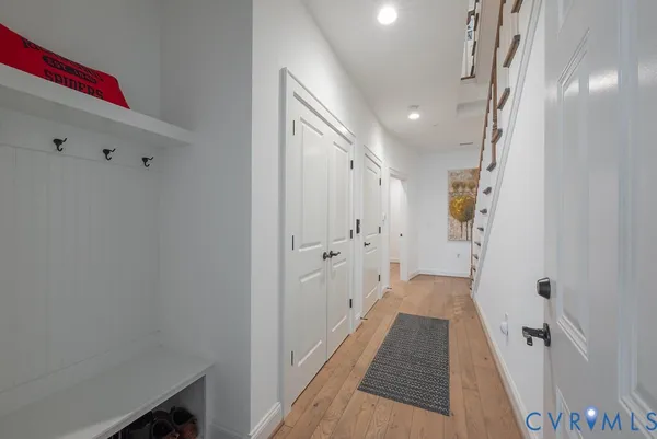 a view of a dining room with furniture and wooden floor