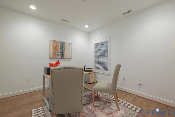 a bathroom with a toilet a sink and shower