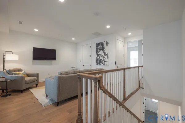 a bedroom with a bed and glass door
