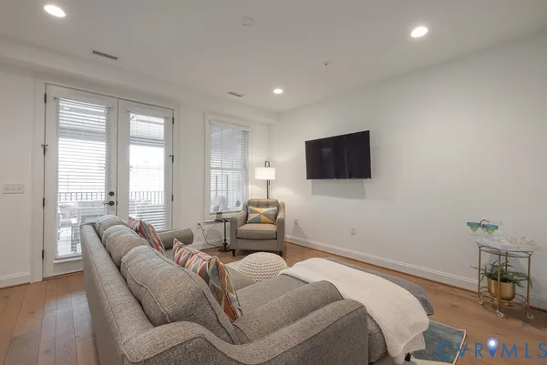 a bathroom with a toilet a sink and a mirror