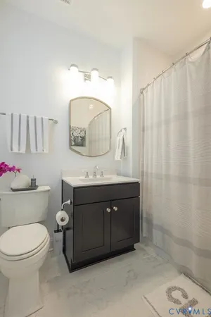 a view of a street with a brick building in front of it
