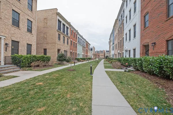 a kitchen with lots of wooden furniture a dining table and chairs