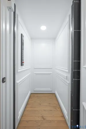 a kitchen with stainless steel appliances granite countertop a sink a stove and chairs