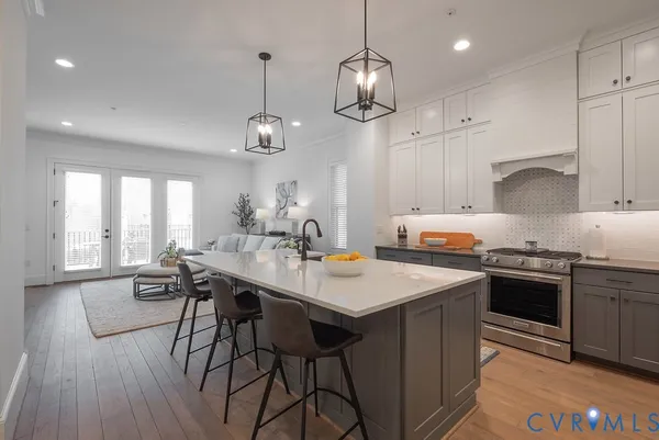a view of a kitchen with a refrigerator and a window