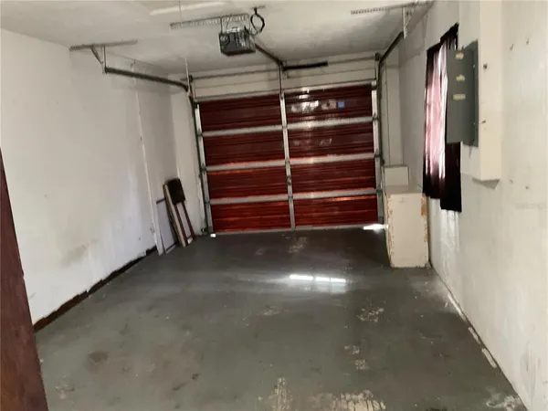 a view of walk in closet with clothes