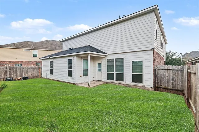 a front view of a house with a yard and porch
