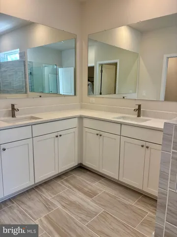 a white toilet sitting next to a white sink