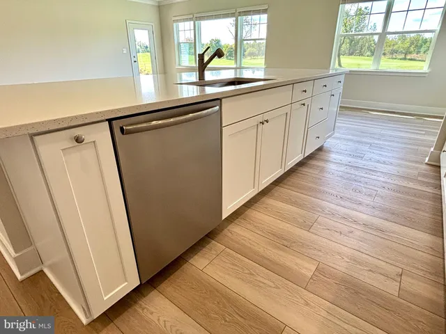 a view of a kitchen from the hallway