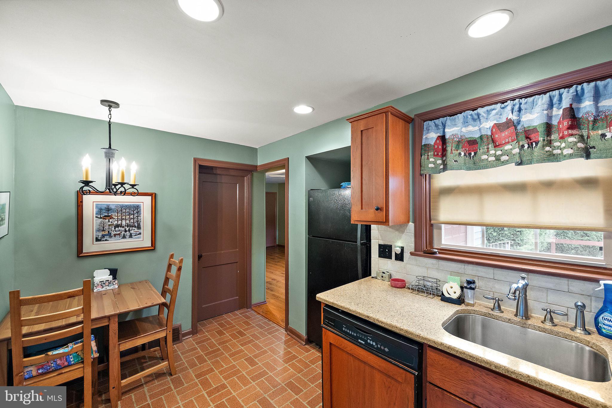 227 Pine Ridge Road Havertown, PA 19083 - Photo 15 of 36 a kitchen with stainless steel appliances a sink stove and refrigerator