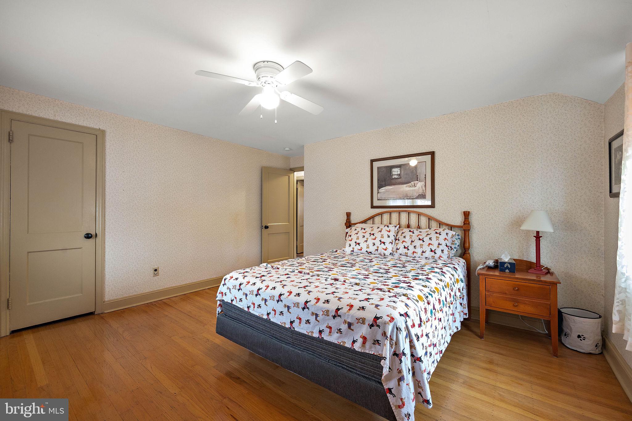 227 Pine Ridge Road Havertown, PA 19083 - Photo 19 of 36 a bedroom with a bed and a chandelier
