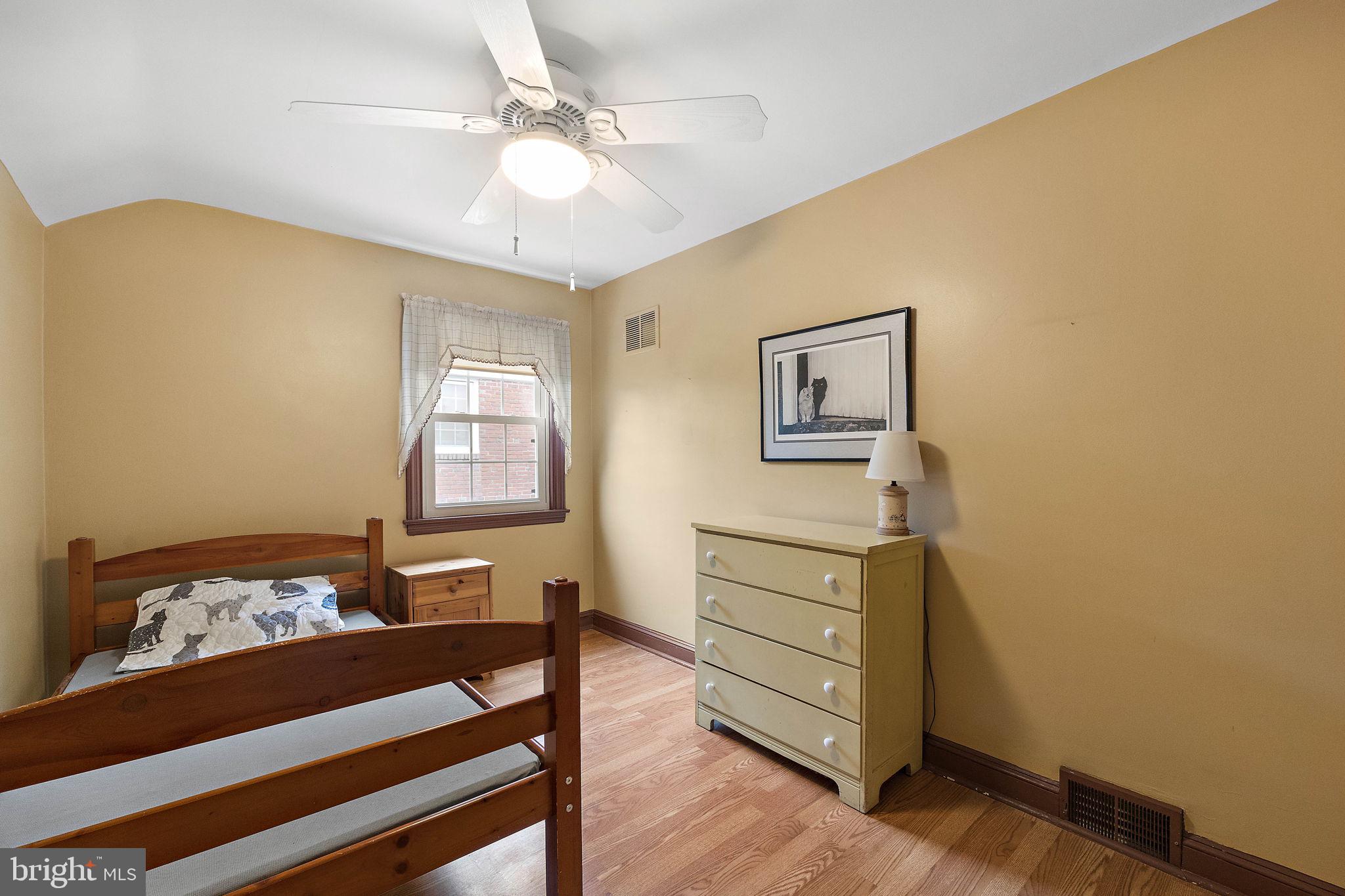 227 Pine Ridge Road Havertown, PA 19083 - Photo 20 of 36 a bedroom with a bed and wooden floor