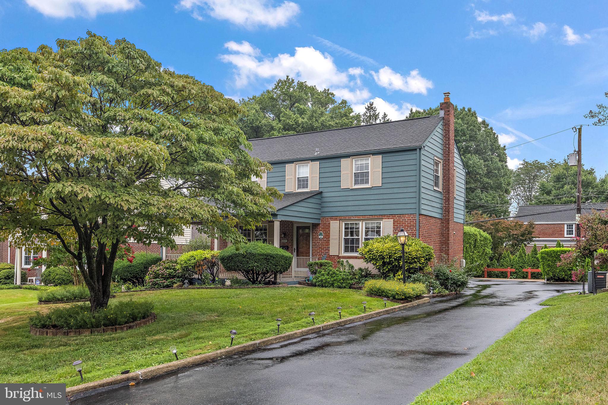 227 Pine Ridge Road Havertown, PA 19083 - Photo 2 of 36 a front view of a house with a garden