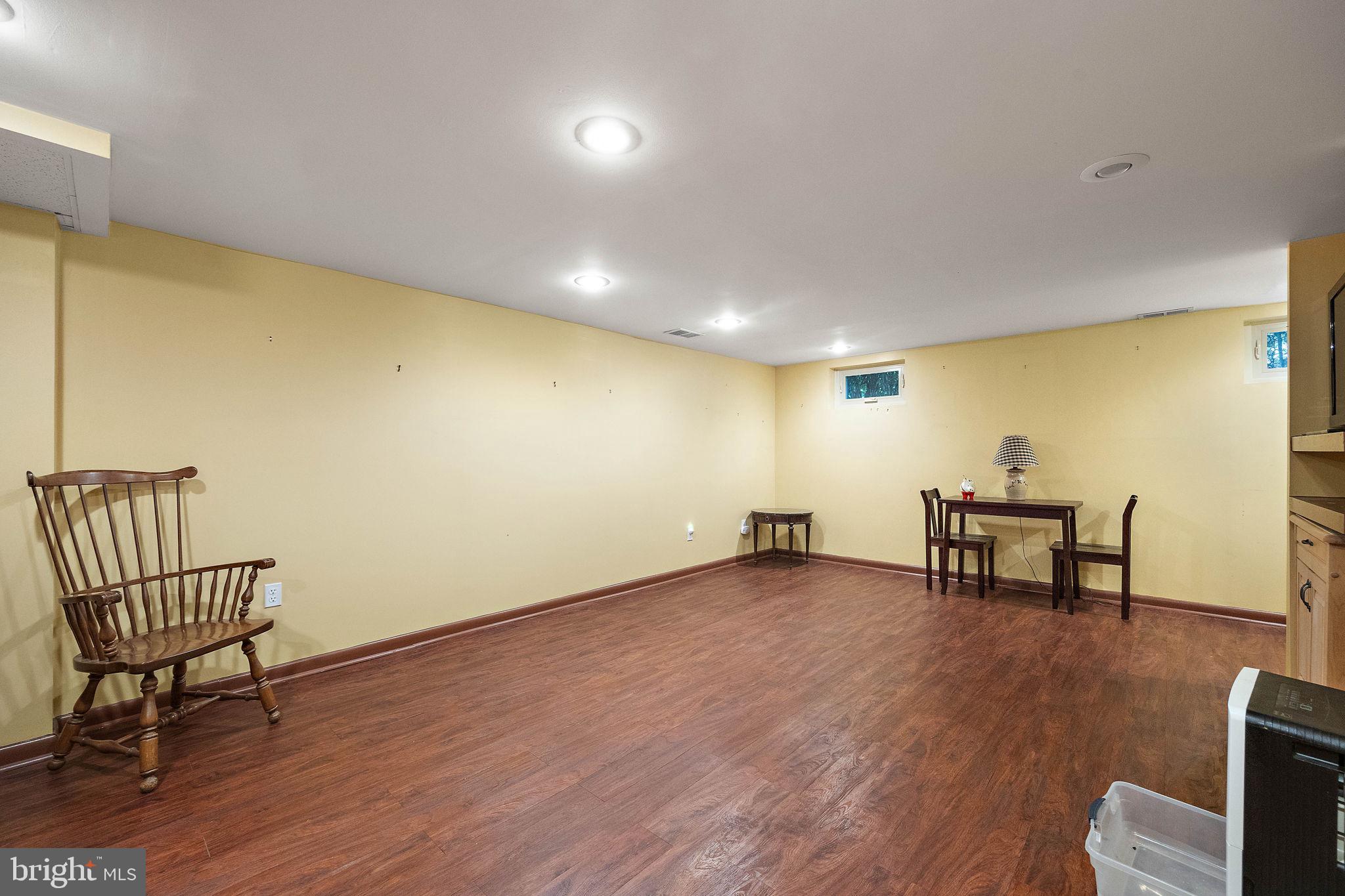 227 Pine Ridge Road Havertown, PA 19083 - Photo 26 of 36 a view of a room with wooden floor and a lounge chair