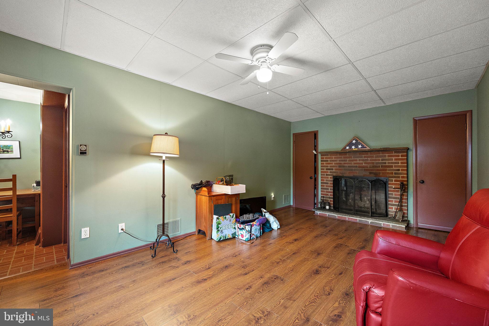 227 Pine Ridge Road Havertown, PA 19083 - Photo 9 of 36 a living room with furniture and a fireplace