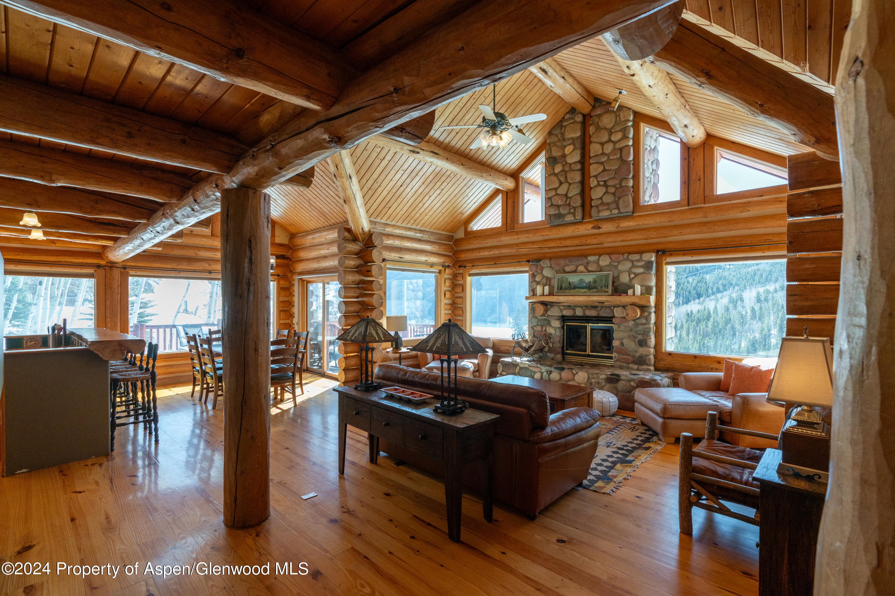 491 McLaughlin Lane Basalt, CO 81621 - Photo 17 of 56 a living room with furniture fireplace and wooden floor