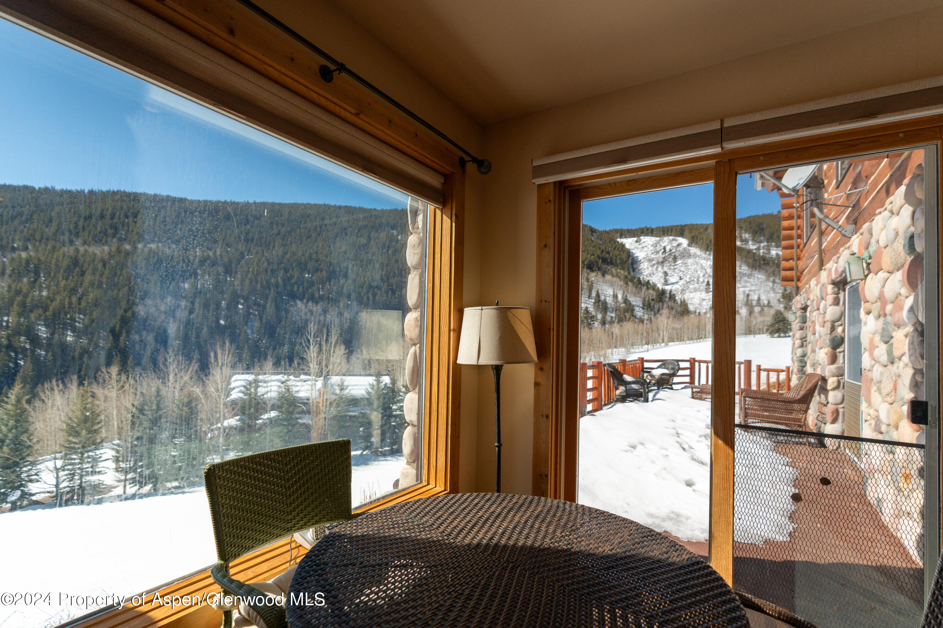 491 McLaughlin Lane Basalt, CO 81621 - Photo 38 of 56 a bedroom with a bed and large windows