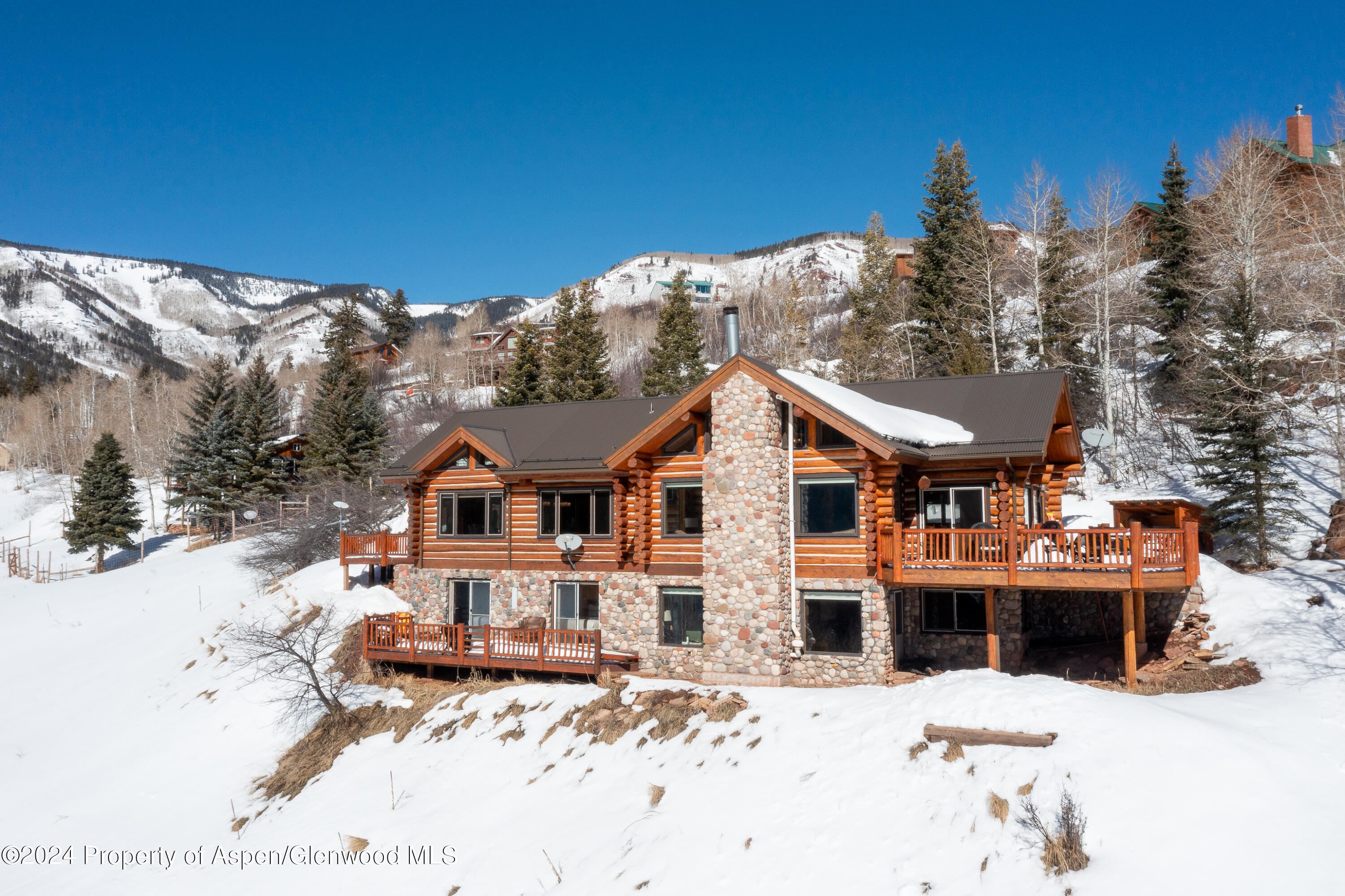 491 McLaughlin Lane Basalt, CO 81621 - Photo 56 of 56 a front view of a house with a yard covered in snow