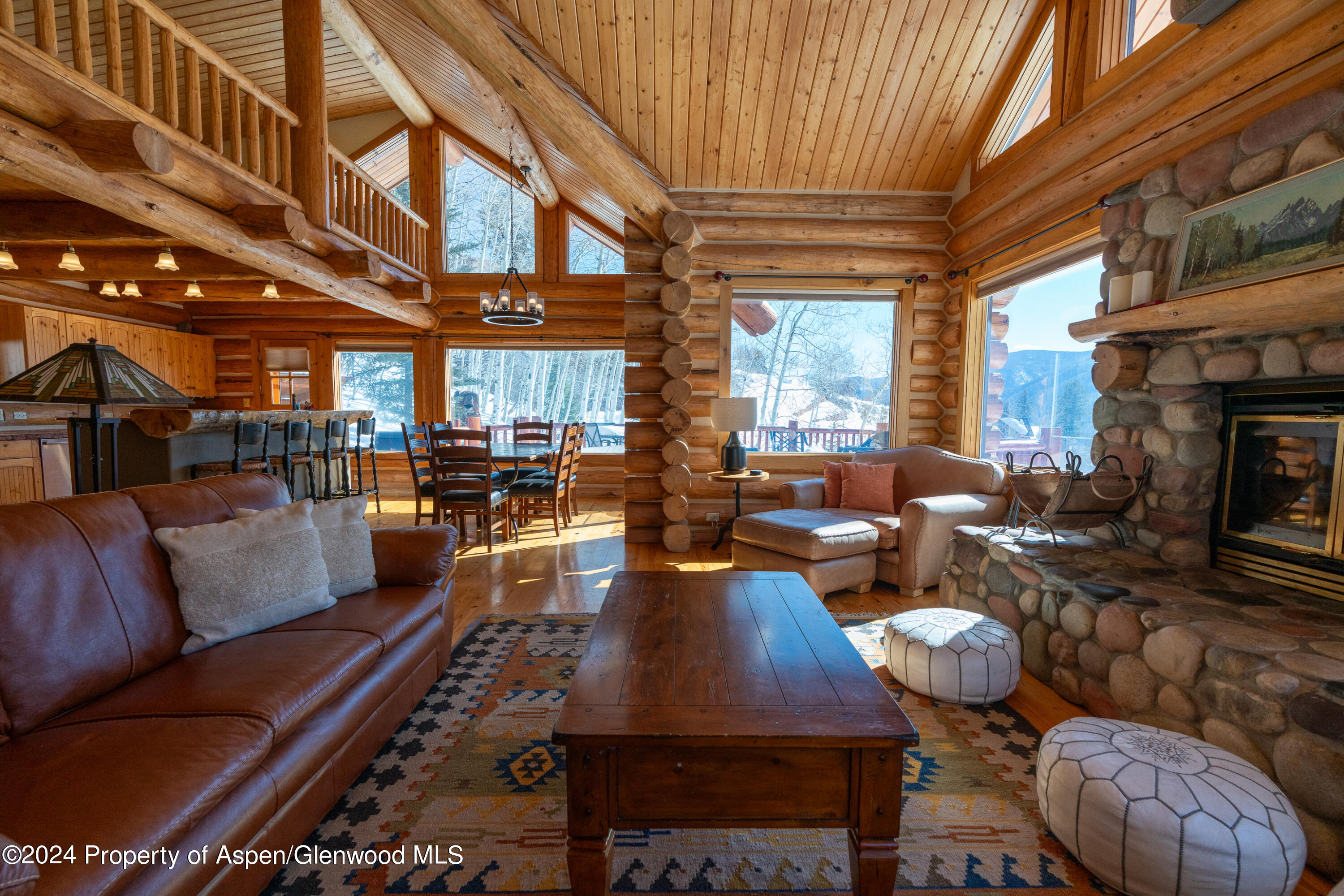 491 McLaughlin Lane Basalt, CO 81621 - Photo 10 of 56 a living room with furniture fireplace and a table