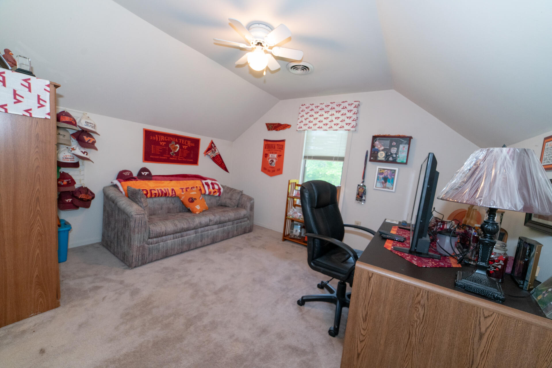 8796 Roanoke Road Elliston, VA 24087 - Photo 27 of 40 a bedroom with a bed and a chandelier