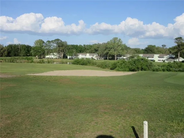 a view of a golf course with a lake