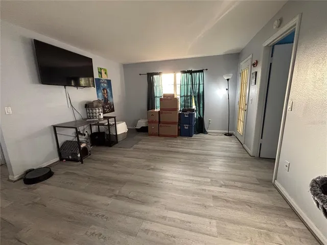 a view of a livingroom with furniture and a flat screen tv