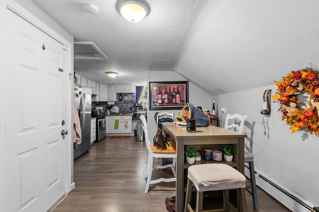 808 Walnut Street Fall River, MA 02720 - Photo 15 of 29 a workspace with furniture and a kitchen