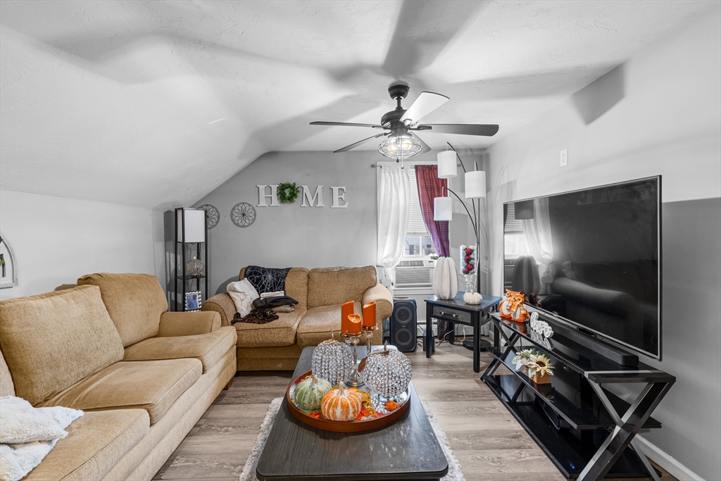 808 Walnut Street Fall River, MA 02720 - Photo 16 of 29 a living room with furniture and a flat screen tv