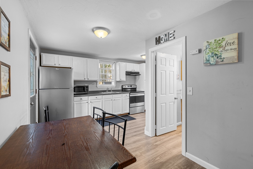 808 Walnut Street Fall River, MA 02720 - Photo 23 of 29 a kitchen with stainless steel appliances a refrigerator and a stove top oven