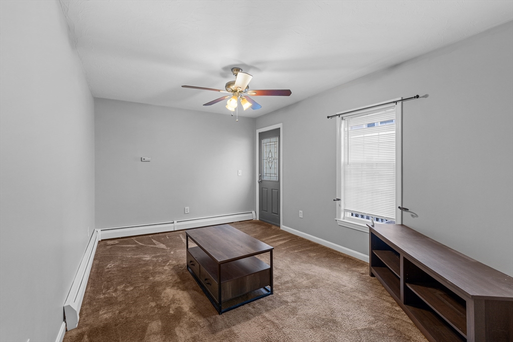 808 Walnut Street Fall River, MA 02720 - Photo 25 of 29 wooden floor in an empty room with a window