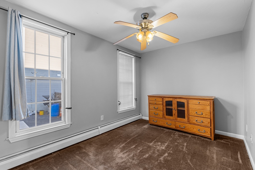 808 Walnut Street Fall River, MA 02720 - Photo 28 of 29 an empty room with windows and fan