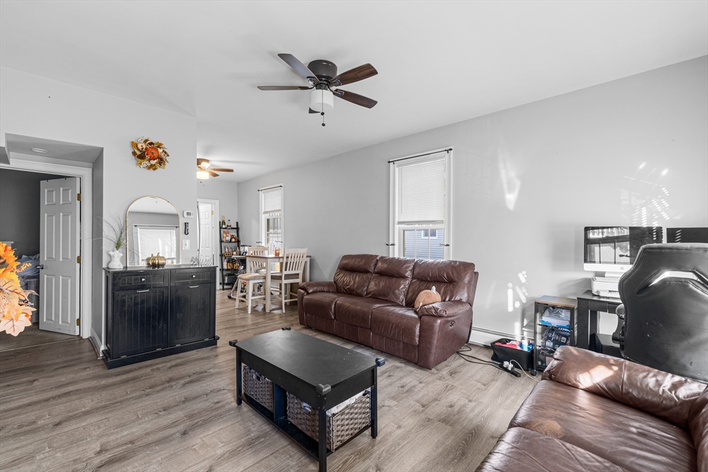 808 Walnut Street Fall River, MA 02720 - Photo 4 of 29 a living room with furniture and a wooden floor