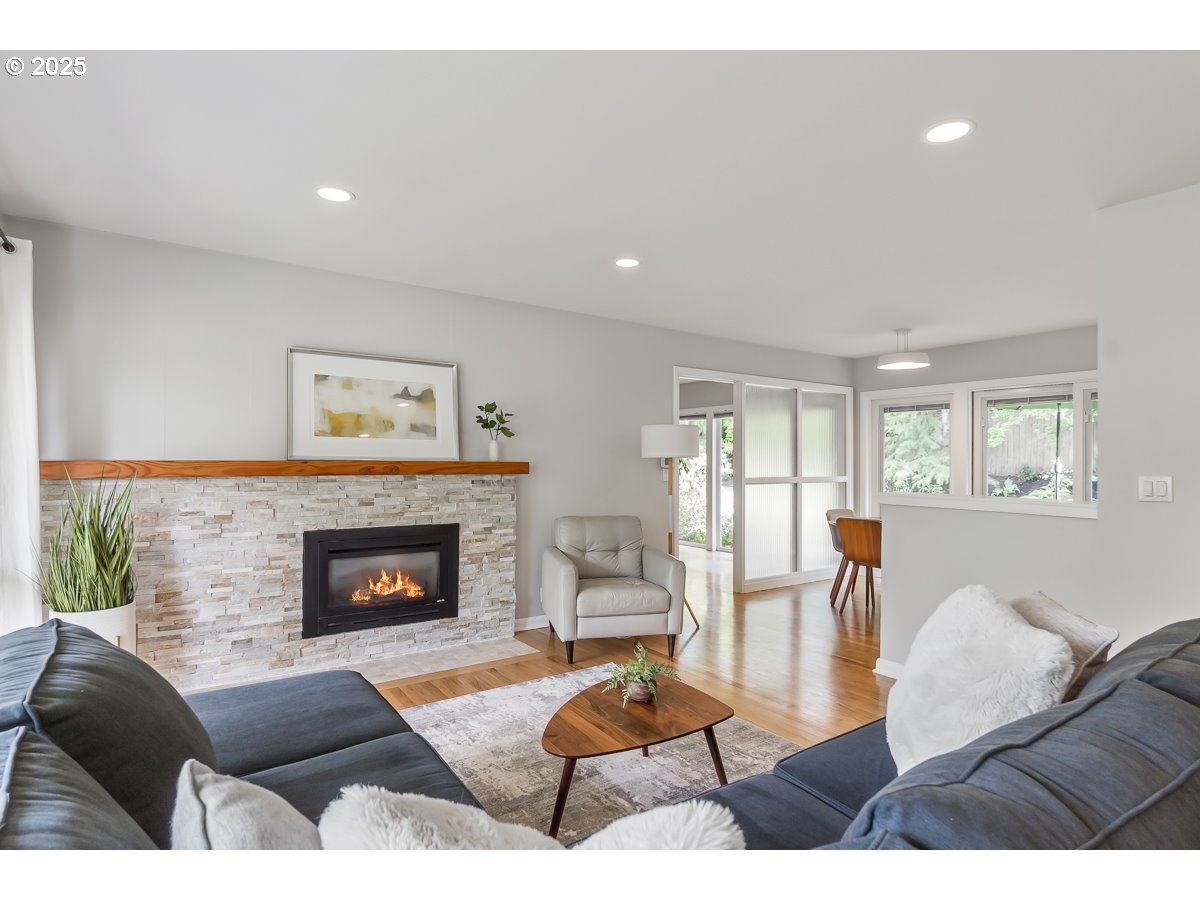 9040 Southwest Rambler Lane Portland, OR 97223 - Photo 6 of 46 a living room with furniture and a fireplace