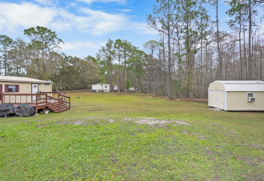 4410 Rues Landing Road St. Augustine, FL 32092 - Photo 16 of 19 a view of a house with backyard and trees