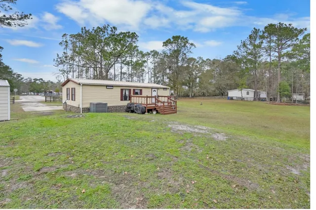a view of a house with a big yard