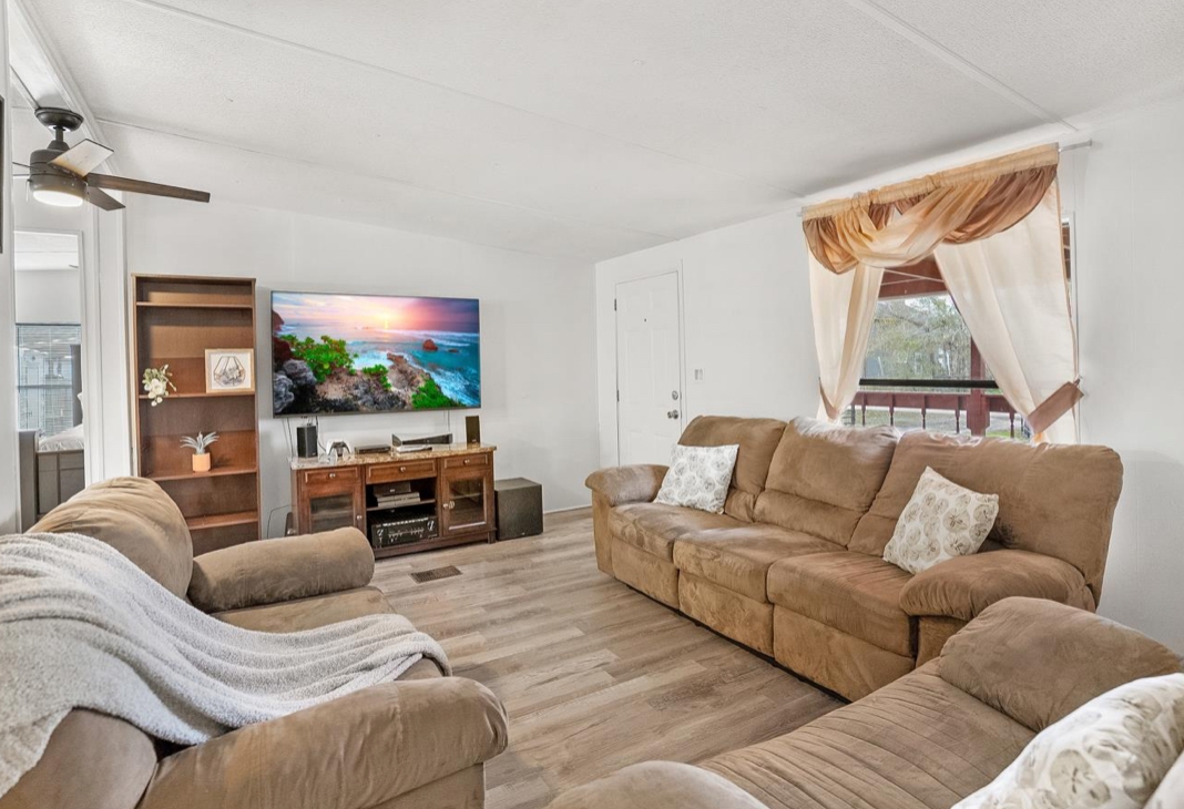 4410 Rues Landing Road St. Augustine, FL 32092 - Photo 5 of 19 a living room with furniture and a flat screen tv