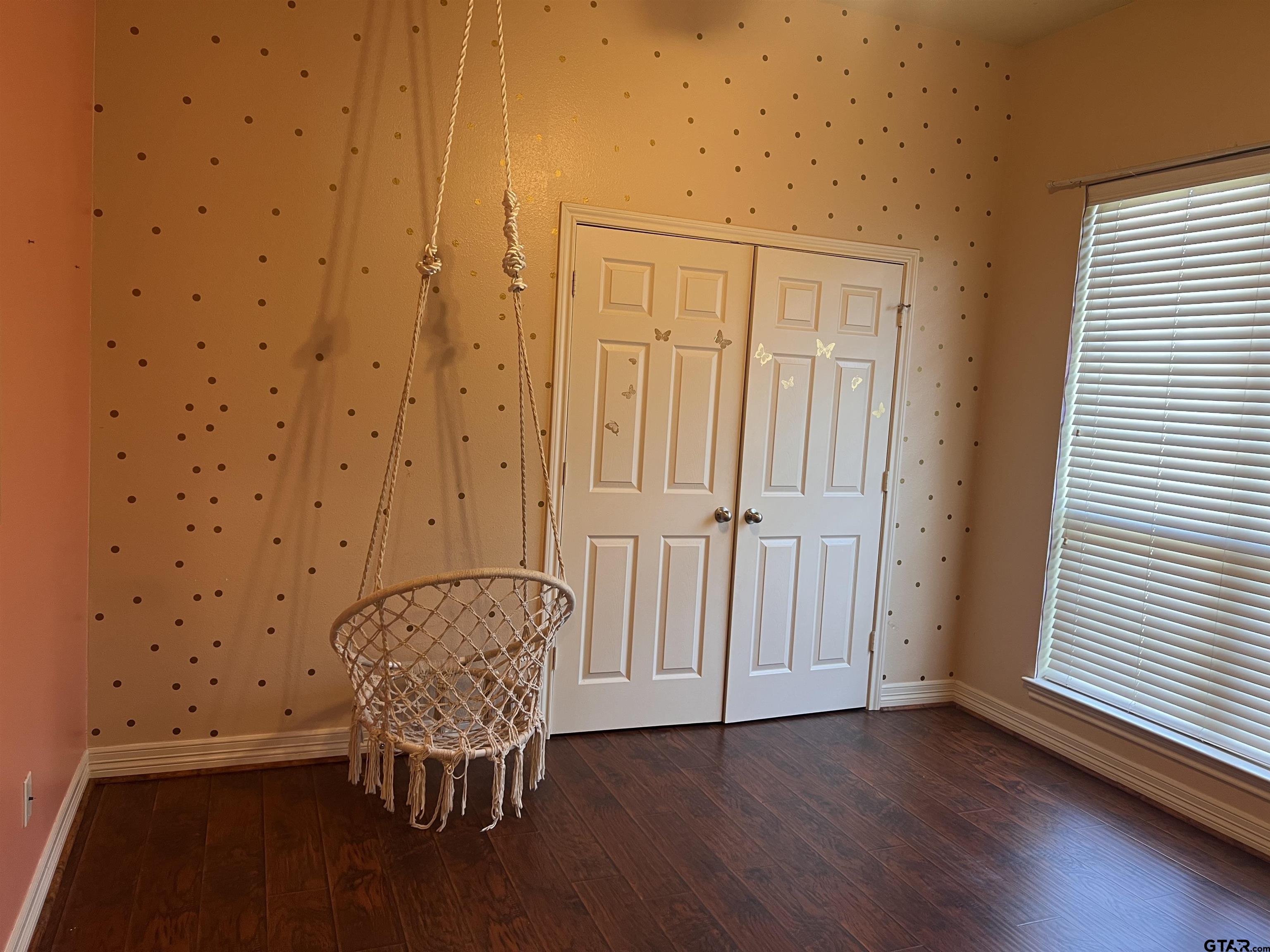 19482 Ruggles Court Flint, TX 75762 - Photo 16 of 16 a view of a room with wooden floor and chair