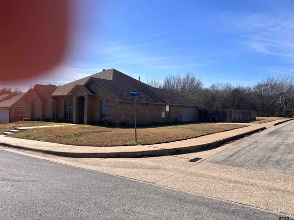 a view of house next to a yard