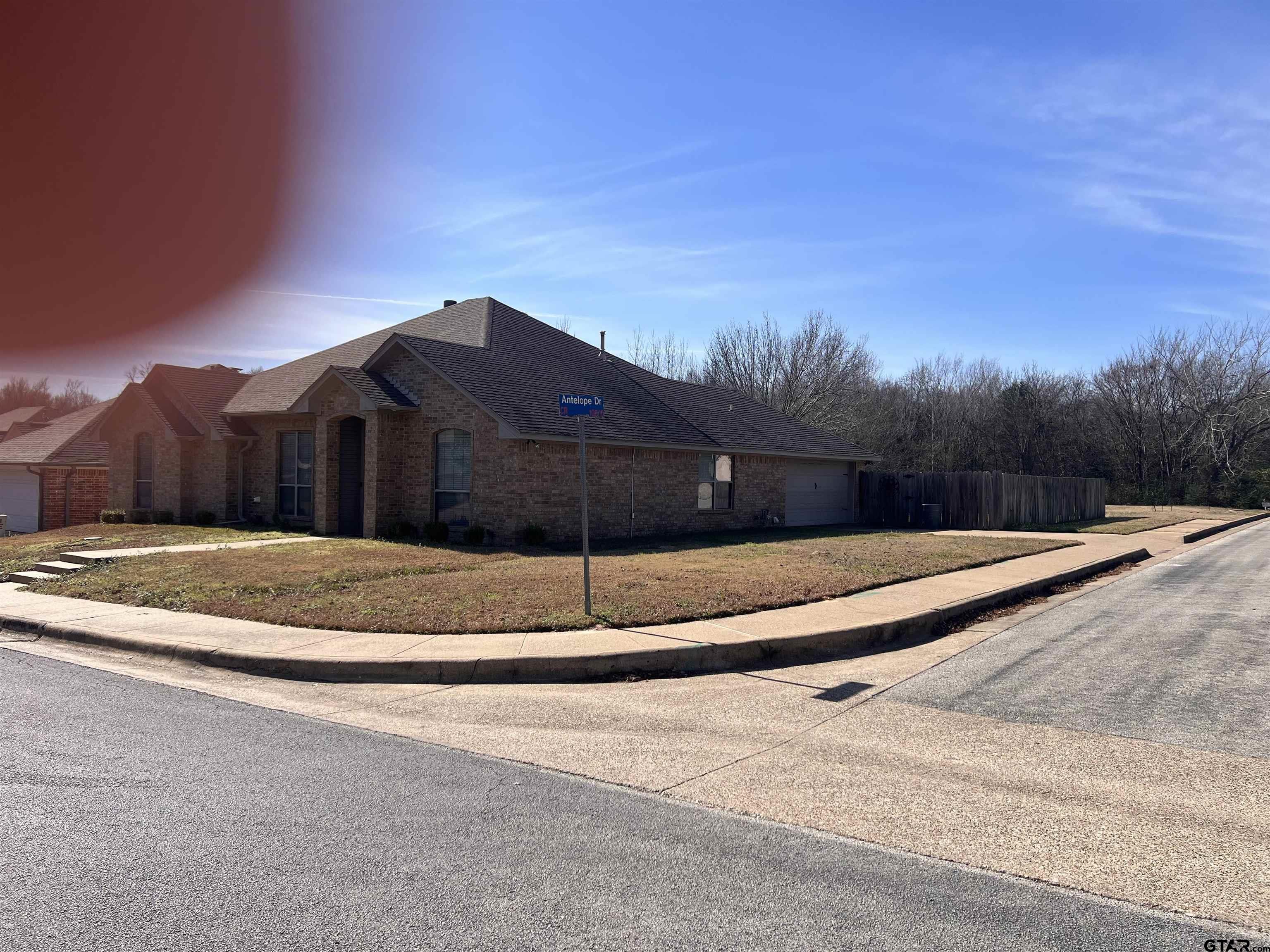 19482 Ruggles Court Flint, TX 75762 - Photo 3 of 16 a view of house next to a yard