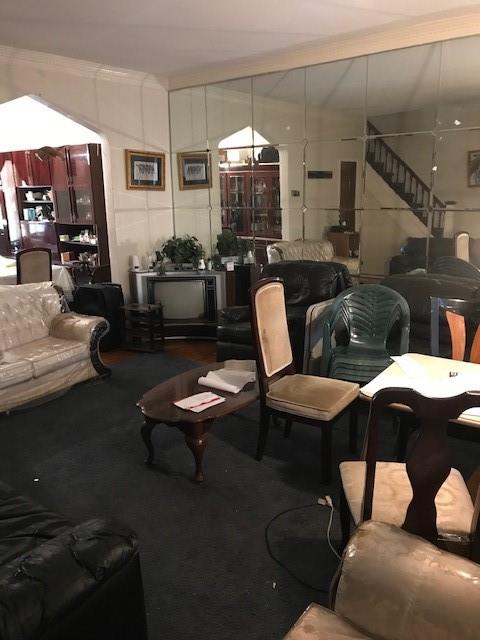 962 East 49th Street Brooklyn, NY 11203 - Photo 11 of 12 a living room with furniture and a dining table with kitchen view