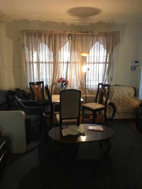 962 East 49th Street Brooklyn, NY 11203 - Photo 12 of 12 a living room with furniture and floor to ceiling windows