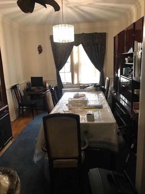 962 East 49th Street Brooklyn, NY 11203 - Photo 9 of 12 a kitchen with stainless steel appliances granite countertop a stove a sink and a refrigerator