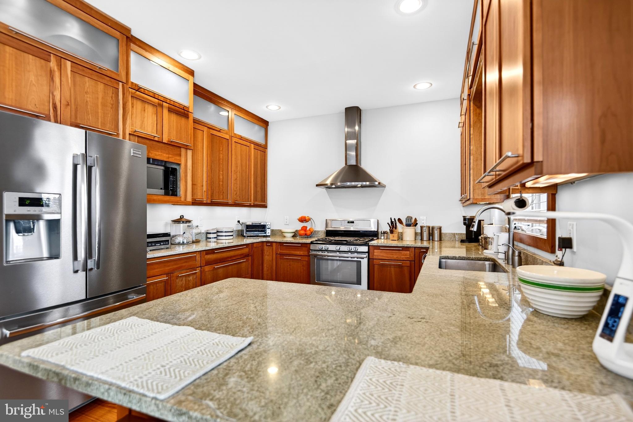 20 Edgewater Drive Tuckerton, NJ 08087 - Photo 13 of 78 a kitchen with stainless steel appliances granite countertop a stove a sink a refrigerator and blue cabinets